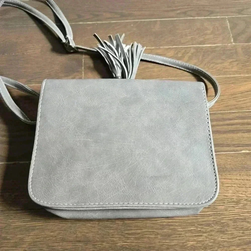 Grey crossbody boho festival bag with tassels from J francis
